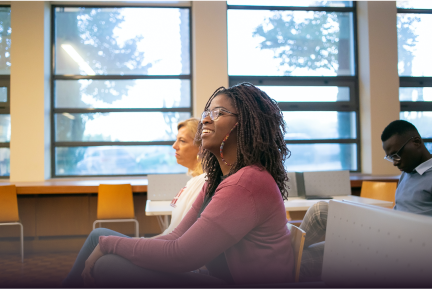 Woman sitting in a life skills training workshop